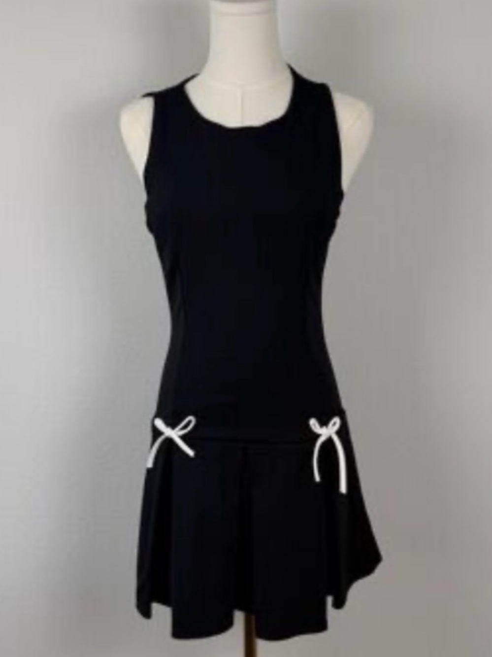 21 Saints Classic Black Sleeveless Mini Dress with White Bow Accents